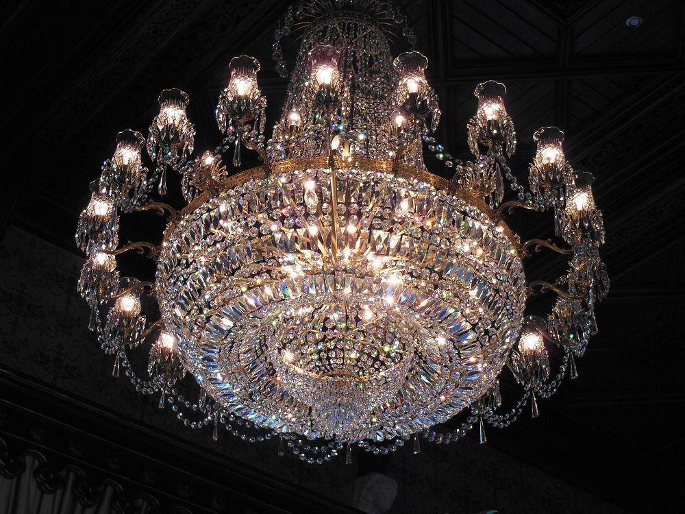 Elegant chandelier hanging from ceiling. Free public domain CC0 image.