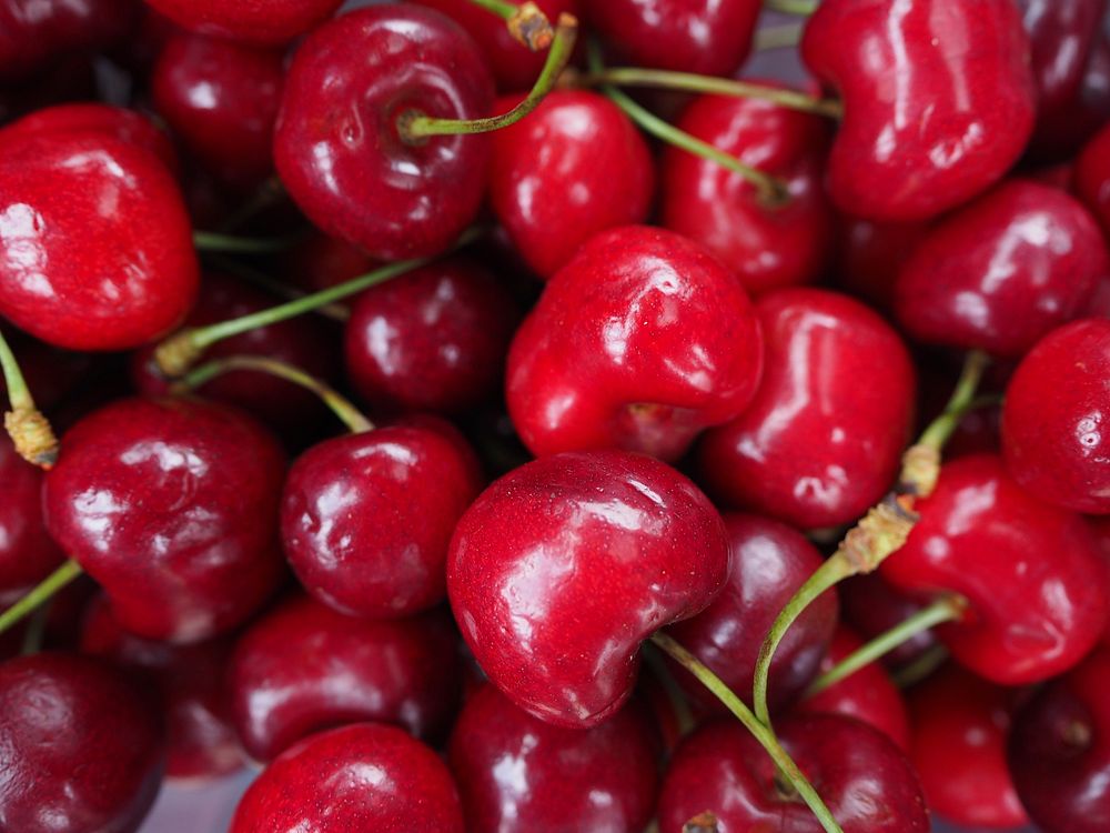 Closeup on pile of red cherries. Free public domain CC0 image. 