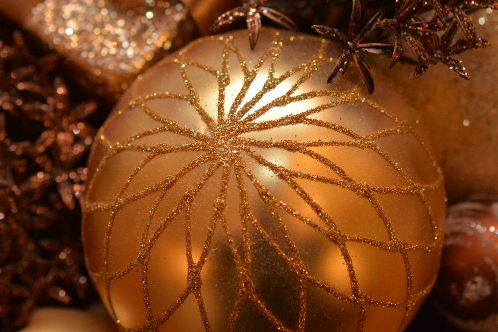 Closeup on golden Christmas ornaments. Free public domain CC0 photo.