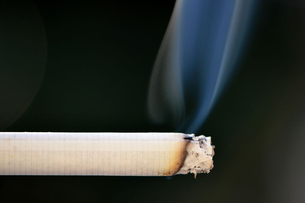 Cigarette with smoke. Free public domain CC0 photo.
