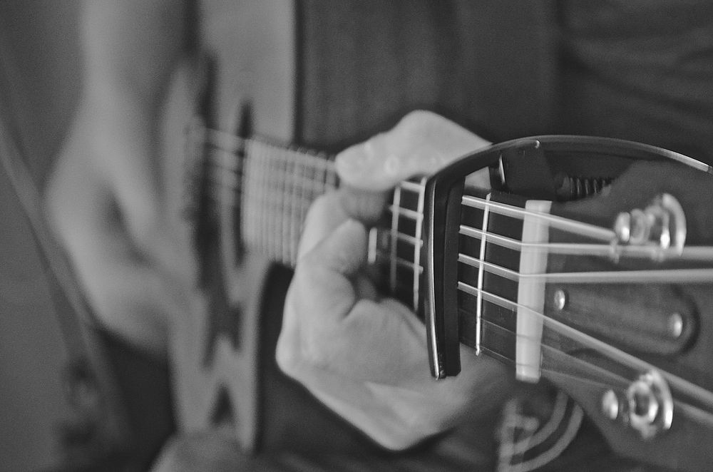 Musician playing guitar, music background.Free public domain CC0 photo.