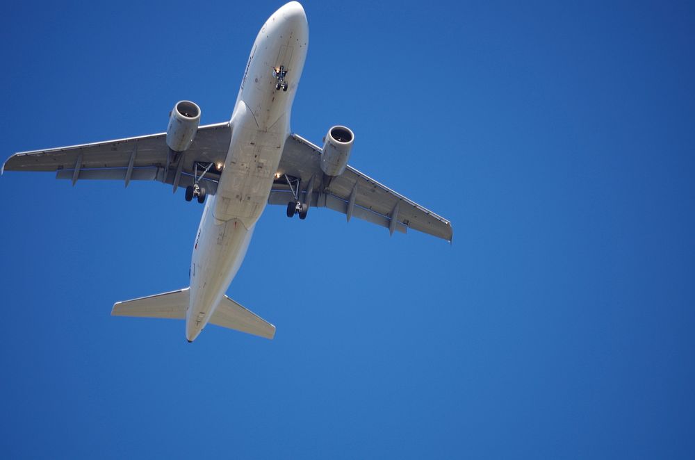 Airplane flying in the sky. Free public domain CC0 photo.