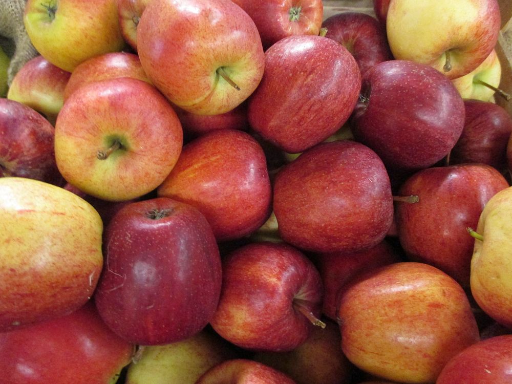Closeup on pile of red apples. Free public domain CC0 photo.