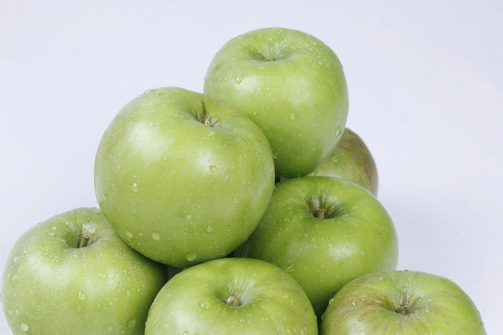Closeup on pile of green apples. Free public domain CC0 photo.