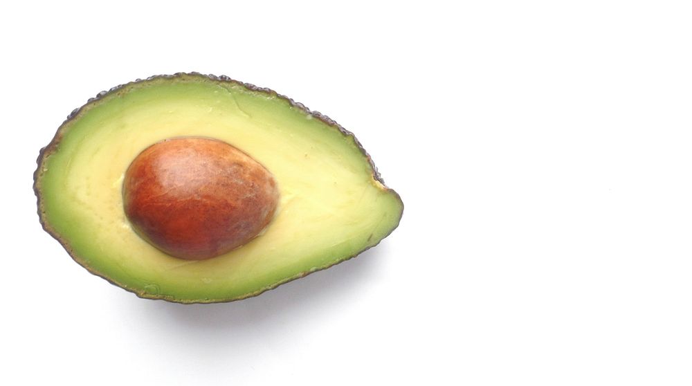 Closeup on avocado cut in half. Free public domain CC0 image.