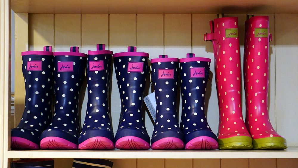 Colorful boots on a shelf. Free public domain CC0 image.