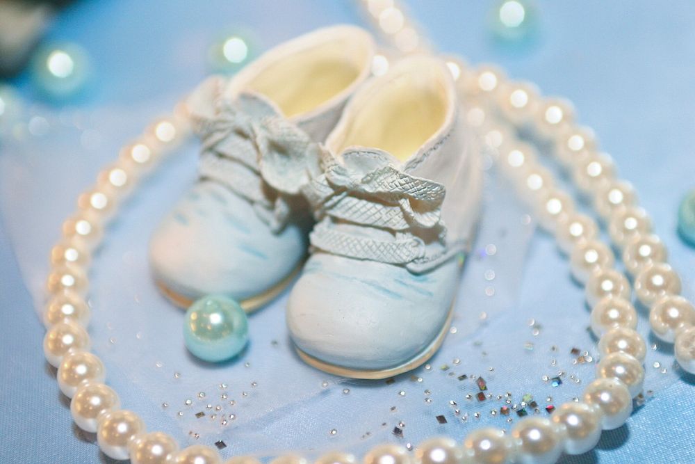 Cute baby shoes & pearls. Free public domain CC0 photo.