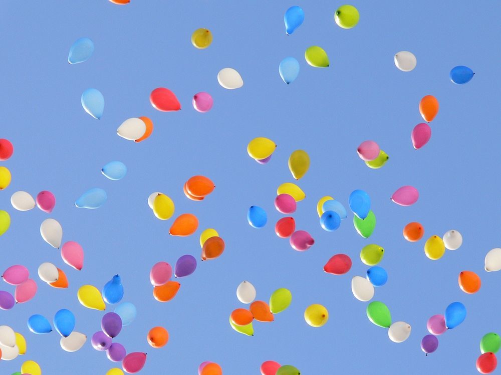 Latex balloon in blue sky. Free public domain CC0 image.