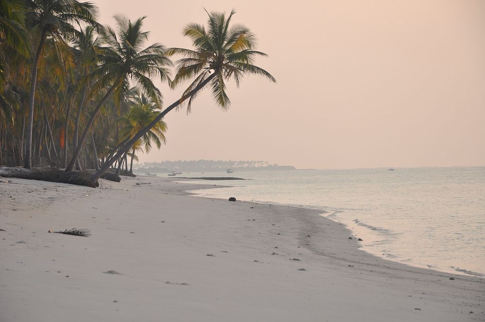 Calm beach during sunset. Free public domain CC0 photo.