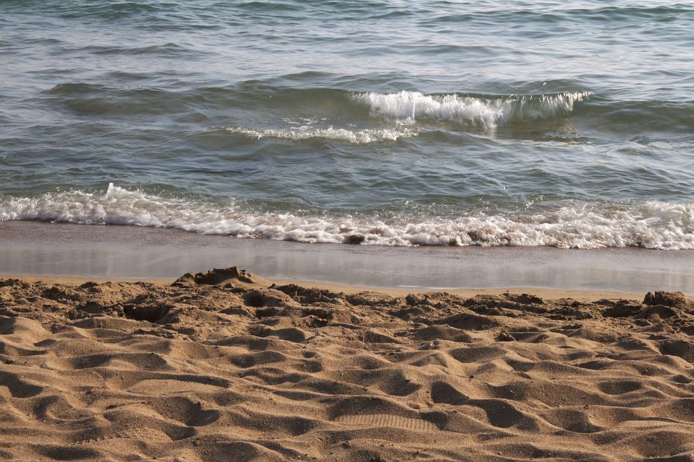 Peaceful crashing beach waves. Free public domain CC0 photo.