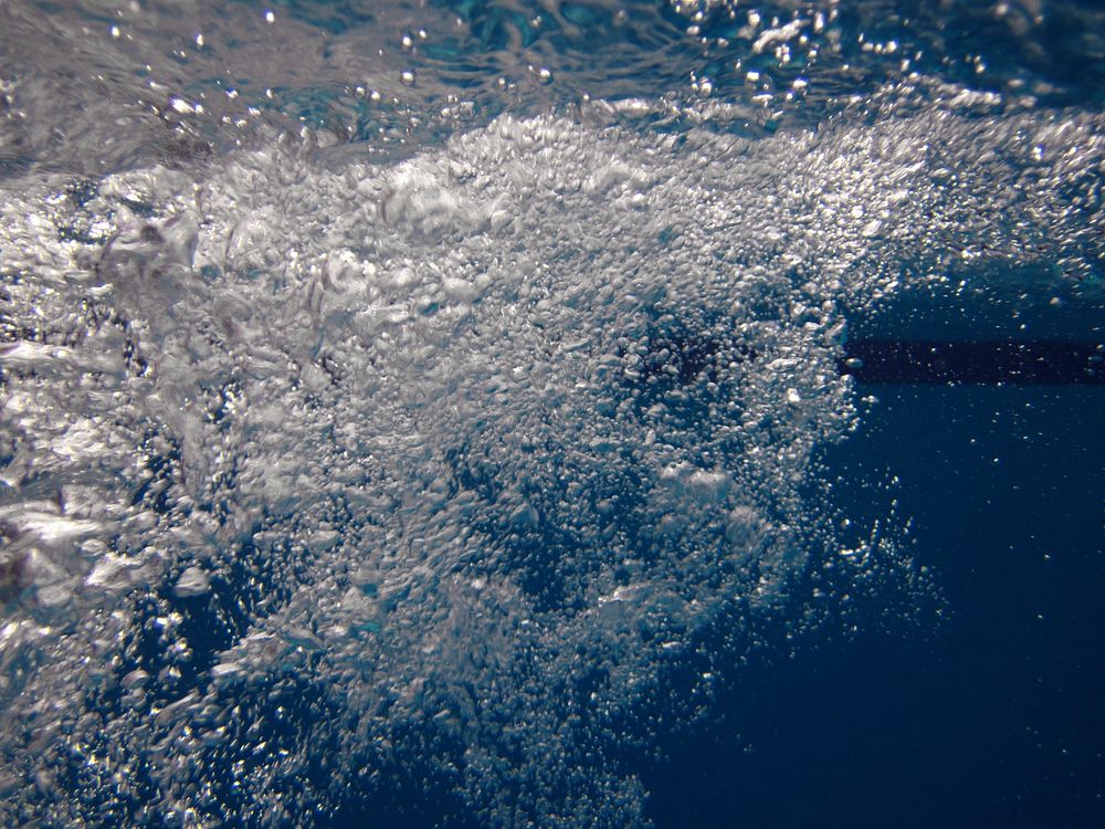 Water bubbles underwater. Free public domain CC0 image.