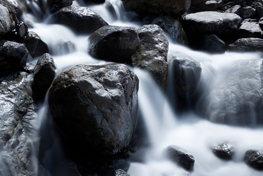 Water streaming down rocks. Free public domain CC0 image.