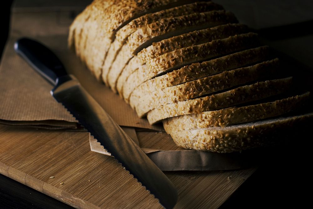 Bread slice with knife. Free public domain CC0 photo.
