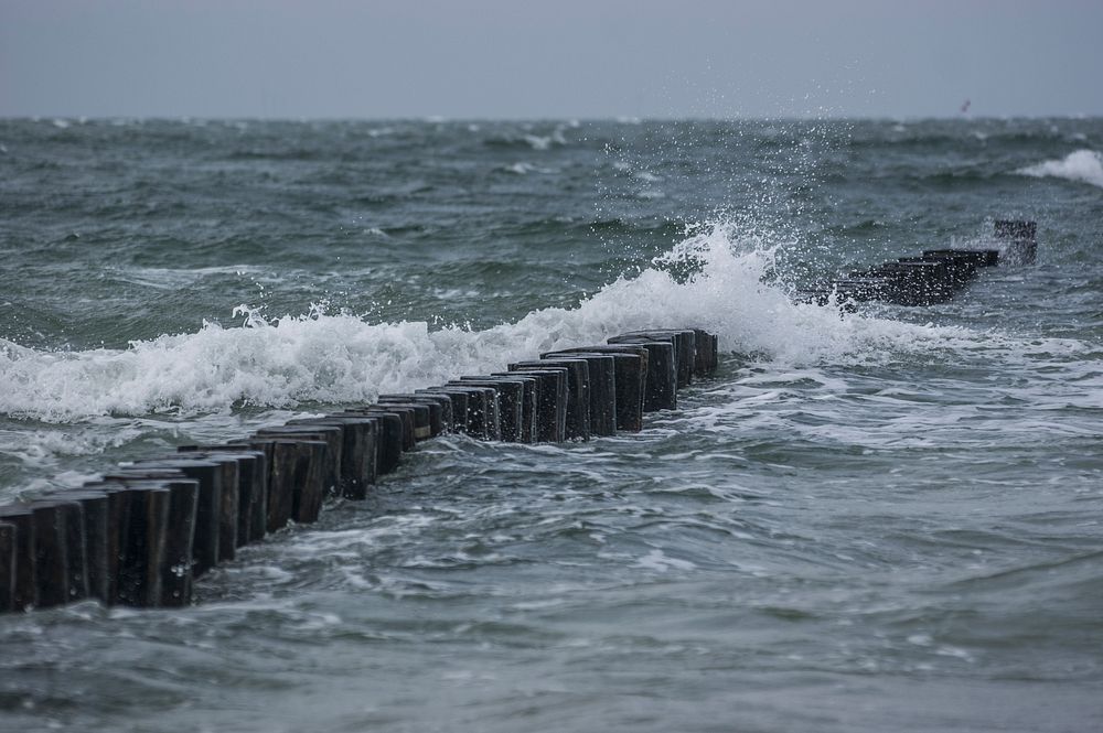 Sea waves crashing into land. Free public domain CC0 photo.