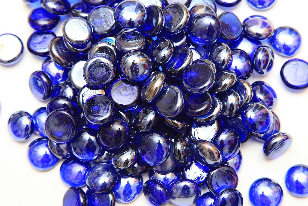 Scattered display of blue stones. Free public domain CC0 photo.