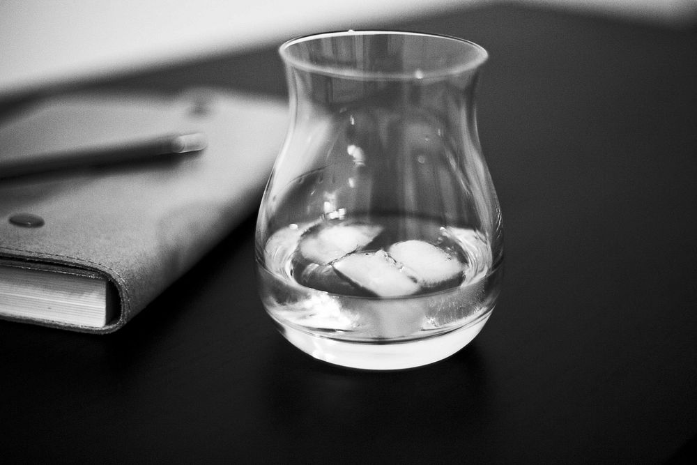 Glass of water on table. Free public domain CC0 photo.