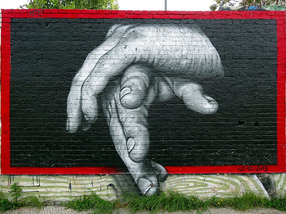 Hands graffiti street art. Location unknown - Feb. 3, 2015