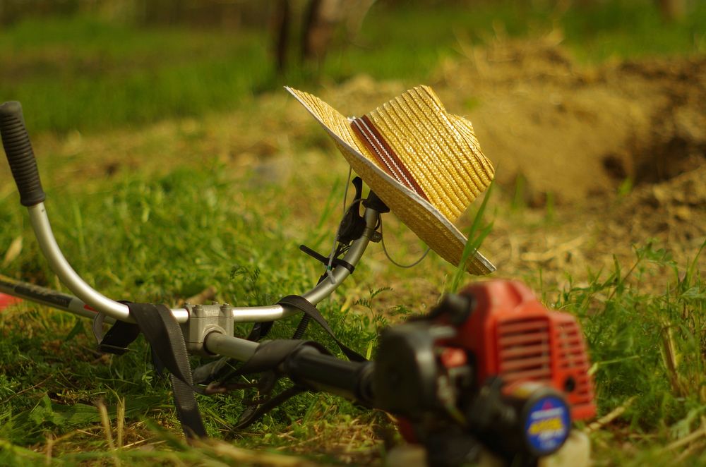 Hat on string trimmer. Free public domain CC0 photo.