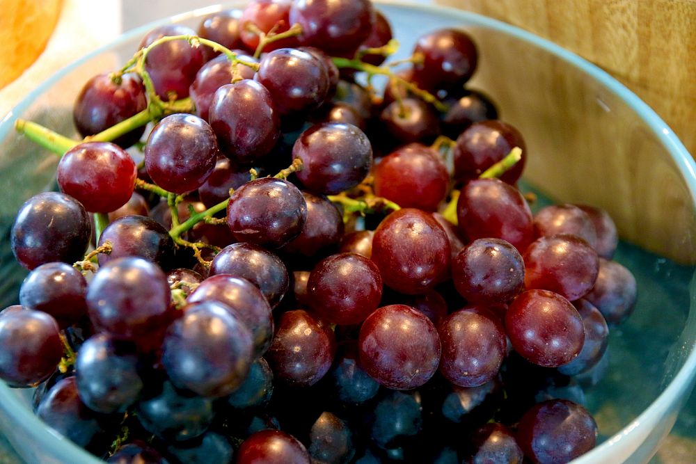 Closeup on red grapes in bowl. Free public domain CC0 photo.