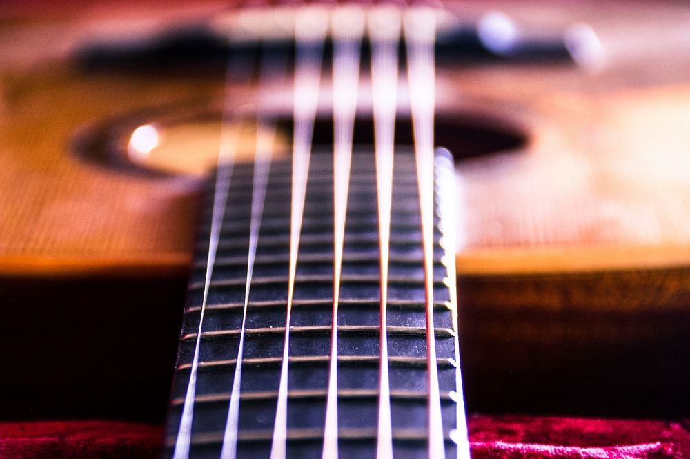 Beautiful acoustic guitar, musical instrument background. Free public domain CC0 photo.