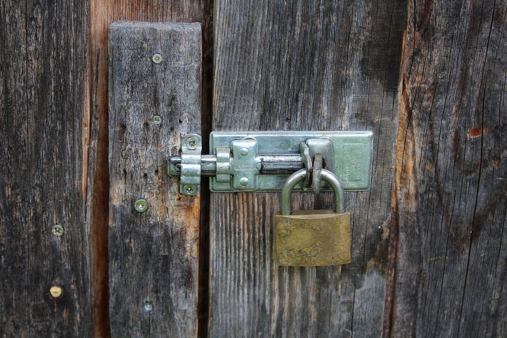 Lock on shed door. Free public domain CC0 photo.