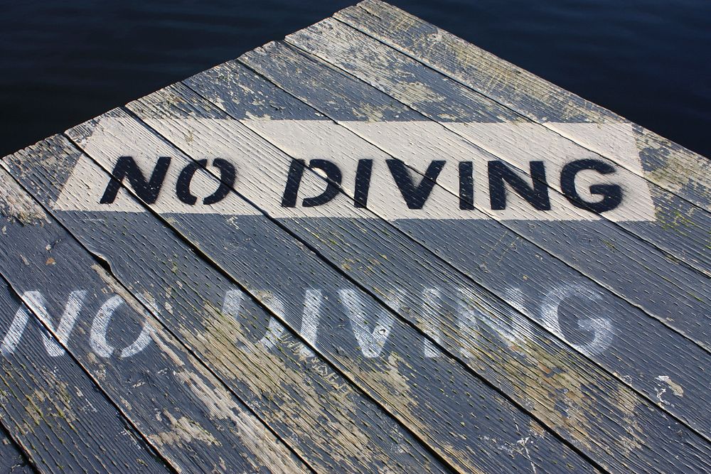 No diving sign on board walk. Free public domain CC0 image.