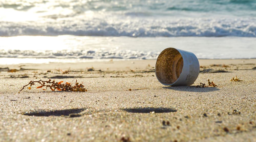 Trash on beach. Free public domain CC0 image.