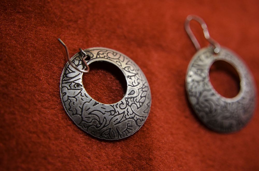 Silver earrings. Free public domain CC0 photo.