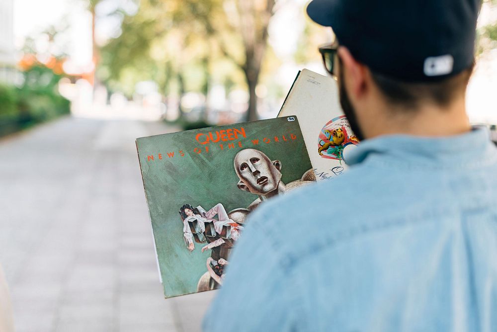 Free man holding a vinyl record image, public domain music CC0 photo.