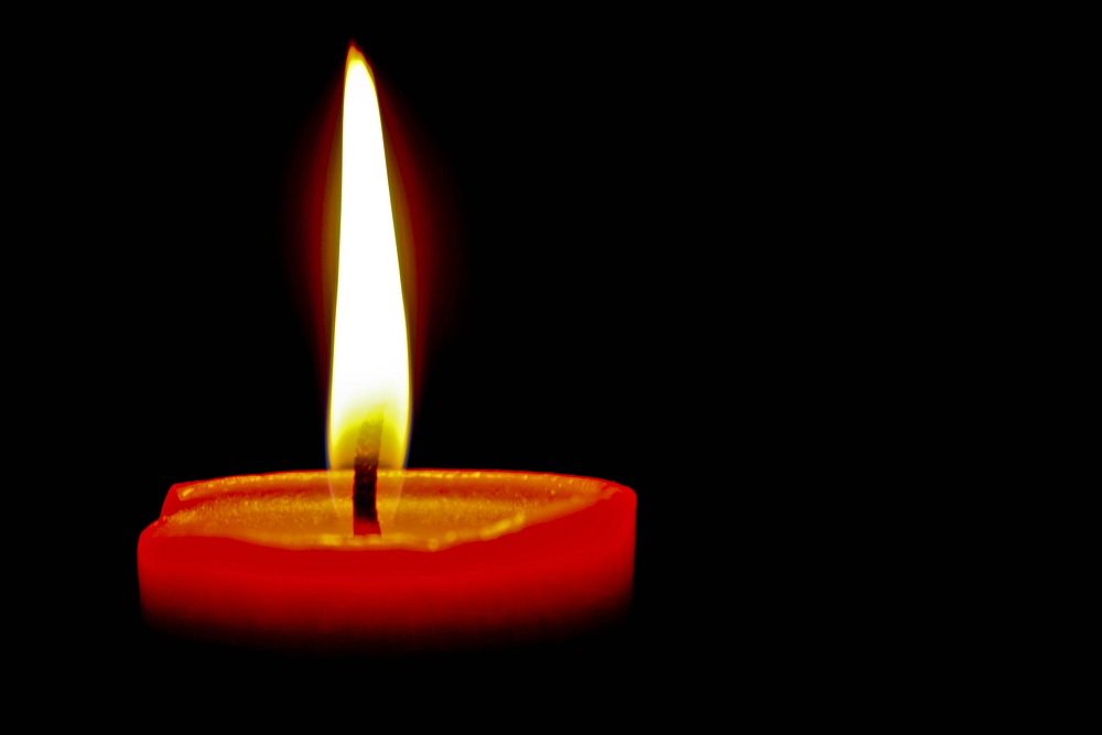 Free candle light fire in dark background photo, public domain CC0 image.