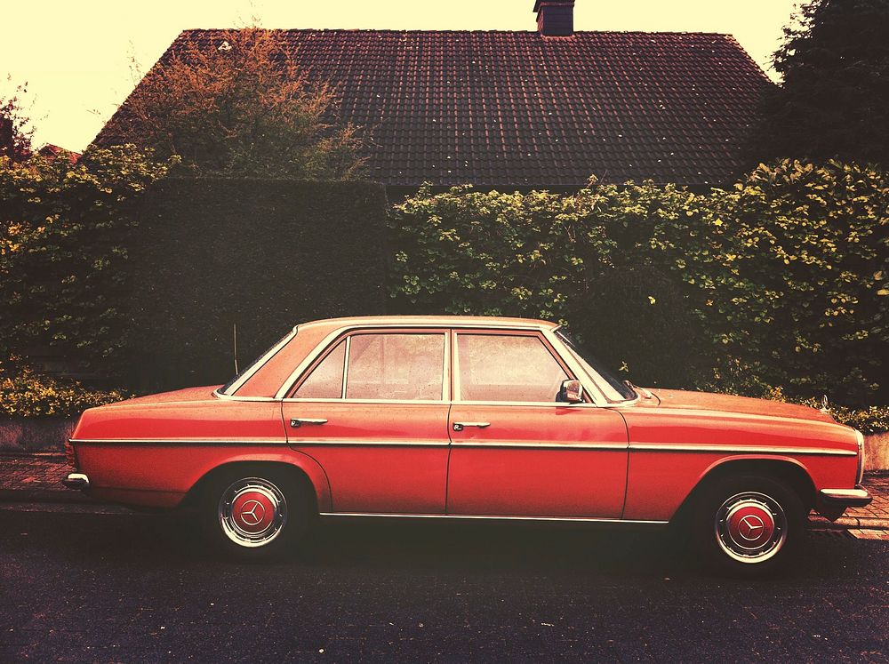Free red classic car park in front of house image, public domain car CC0 photo.