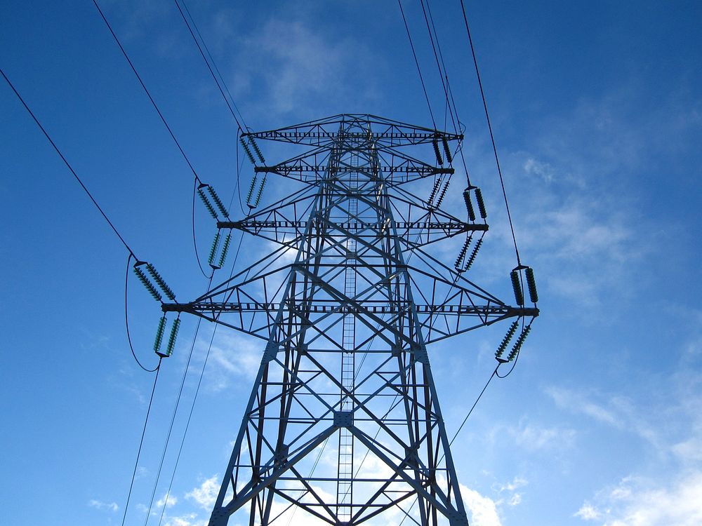 Electric transmission tower power lines. Free public domain CC0 photo.
