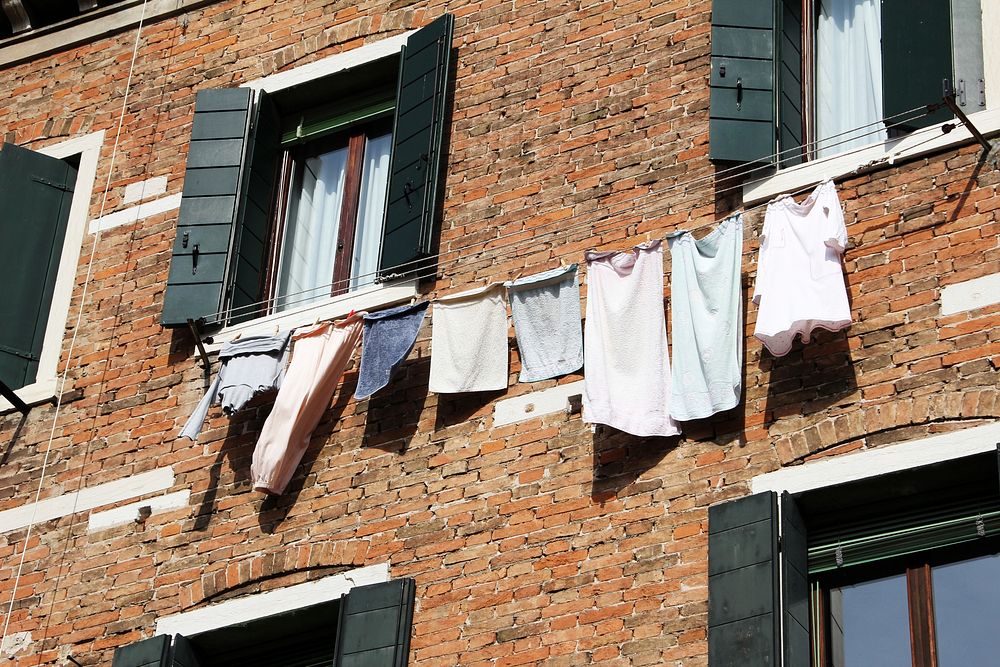 Laundry on building, background photo. Free public domain CC0 image.