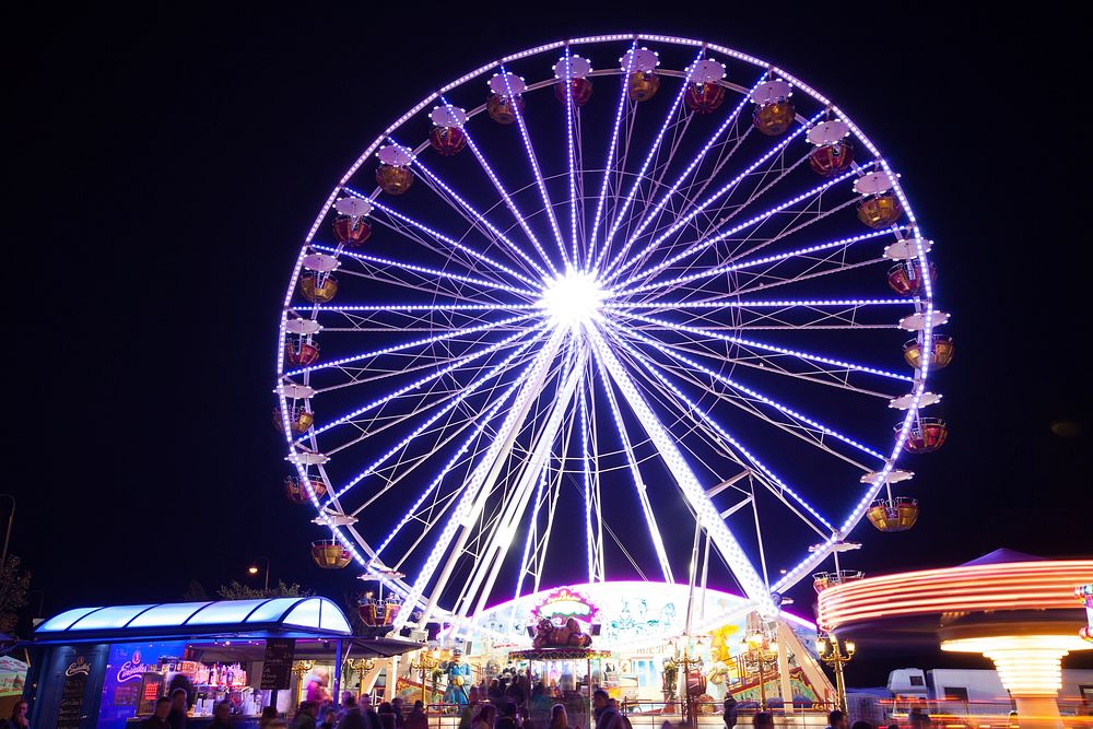 Ferris wheel at amusement park. Free public domain CC0 photo.
