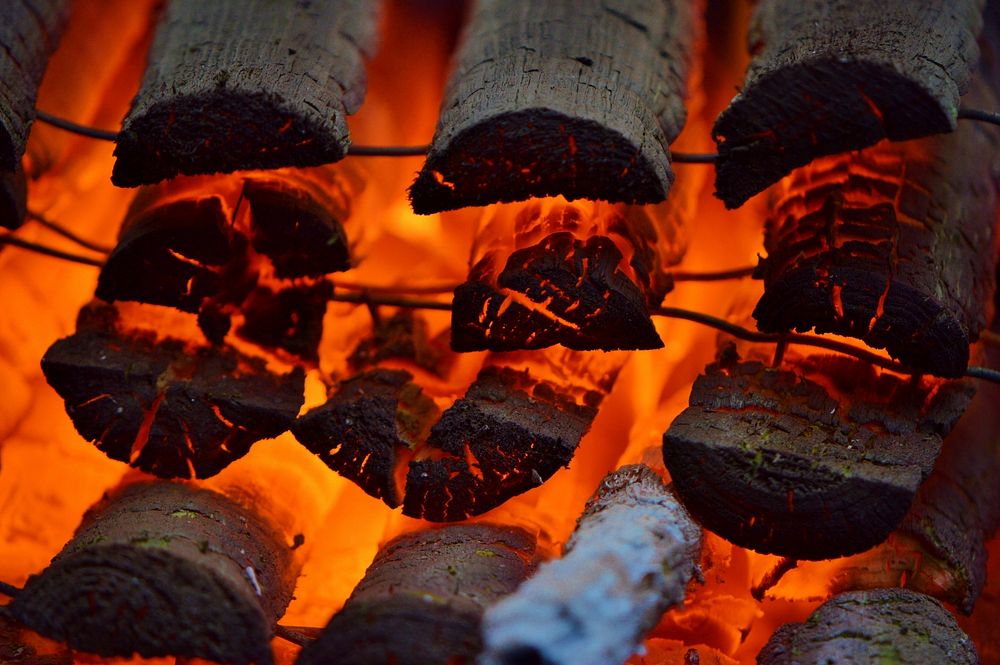Burning firewood with flame background. Free public domain CC0 photo.