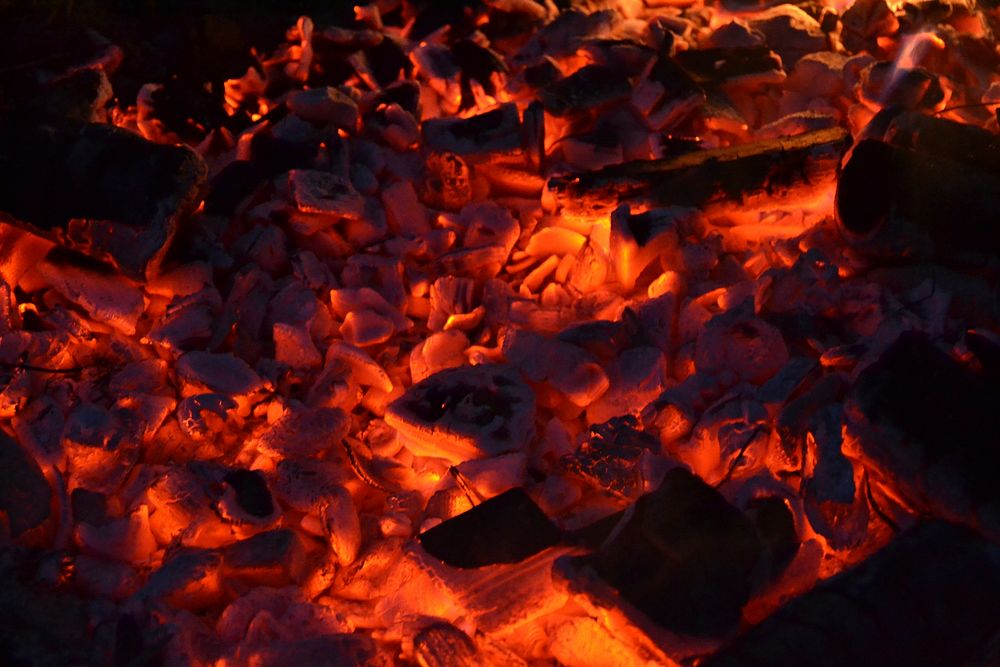Burning firewood & coal background. Free public domain CC0 image.