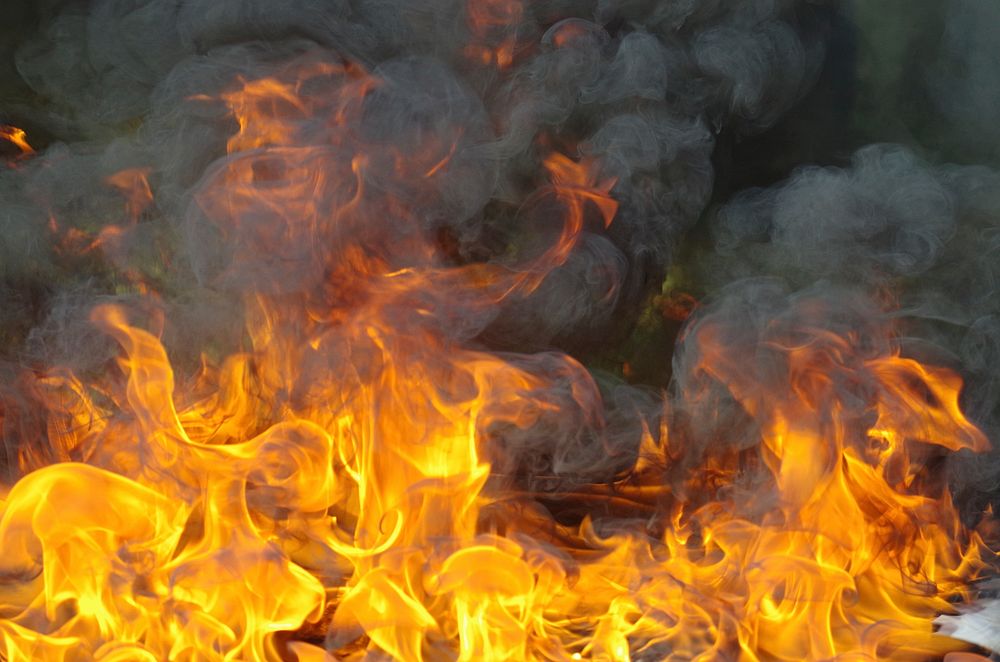 Burning firewood with flame background. Free public domain CC0 photo.