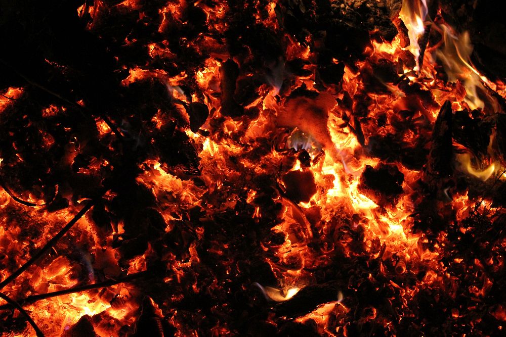 Burning firewood & coal background. Free public domain CC0 image.
