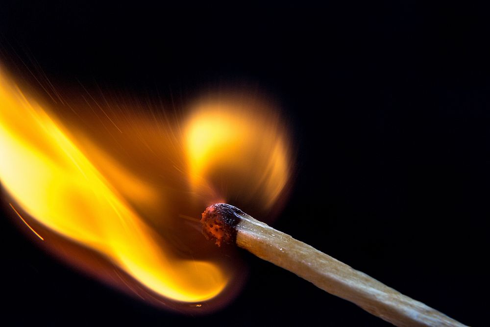 Flame on matching stick. Free public domain CC0 photo.