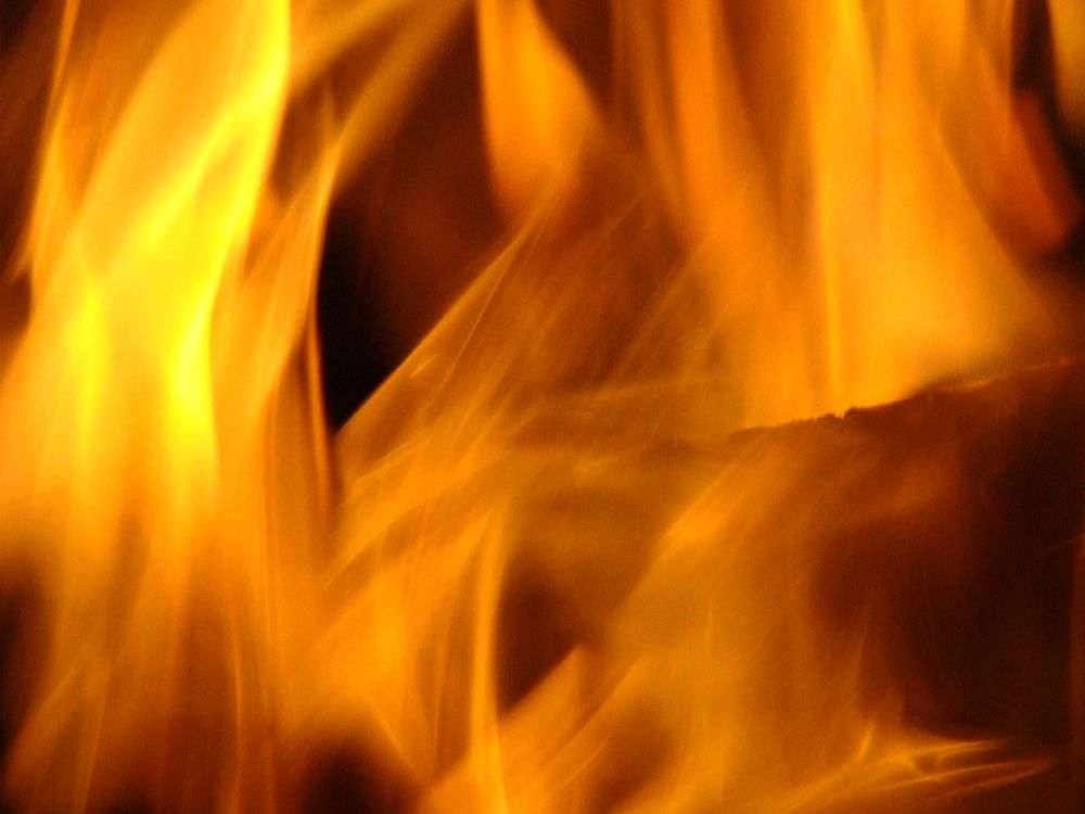 Burning fire, orange background. Free public domain CC0 image.