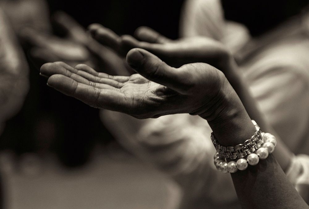 Woman's hand open for prayer. Free public domain CC0 photo.