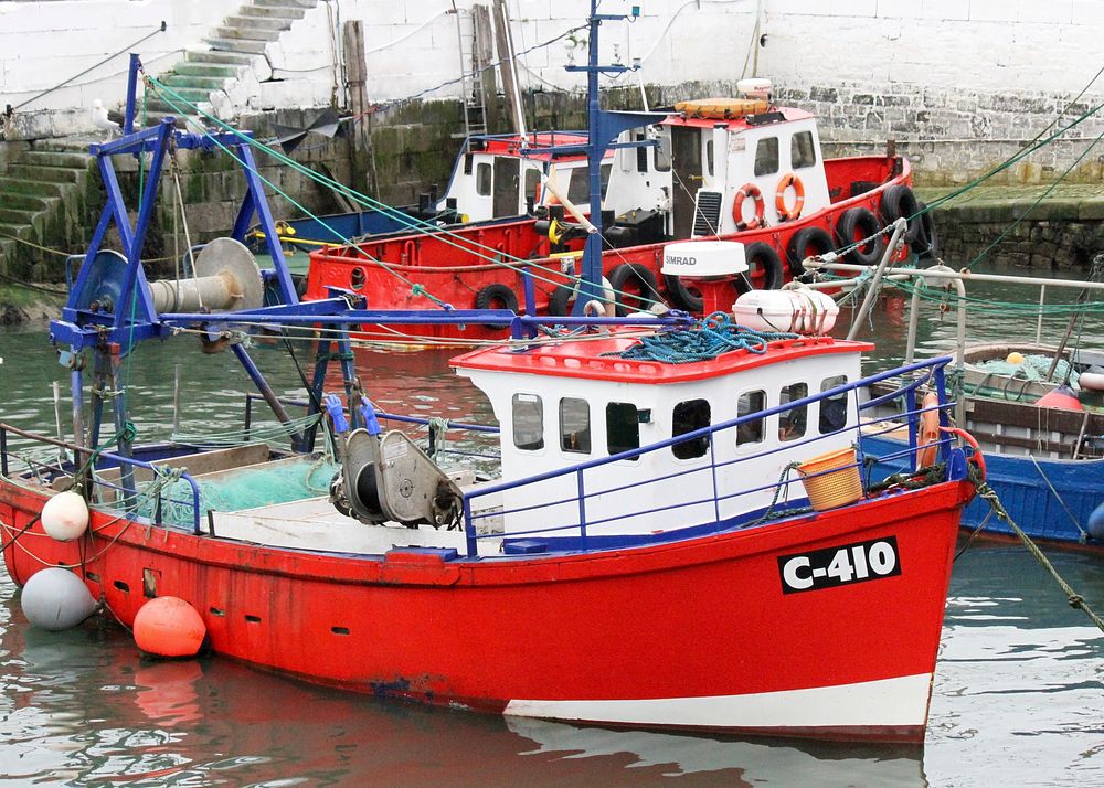 Red fishing boat at dock. Free public domain CC0 photo.