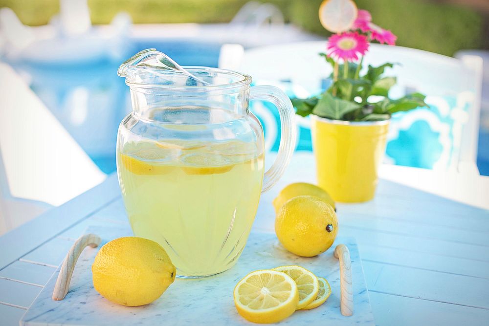 Free lemonade pitcher, summer, pool side photo, public domain beverage CC0 image.