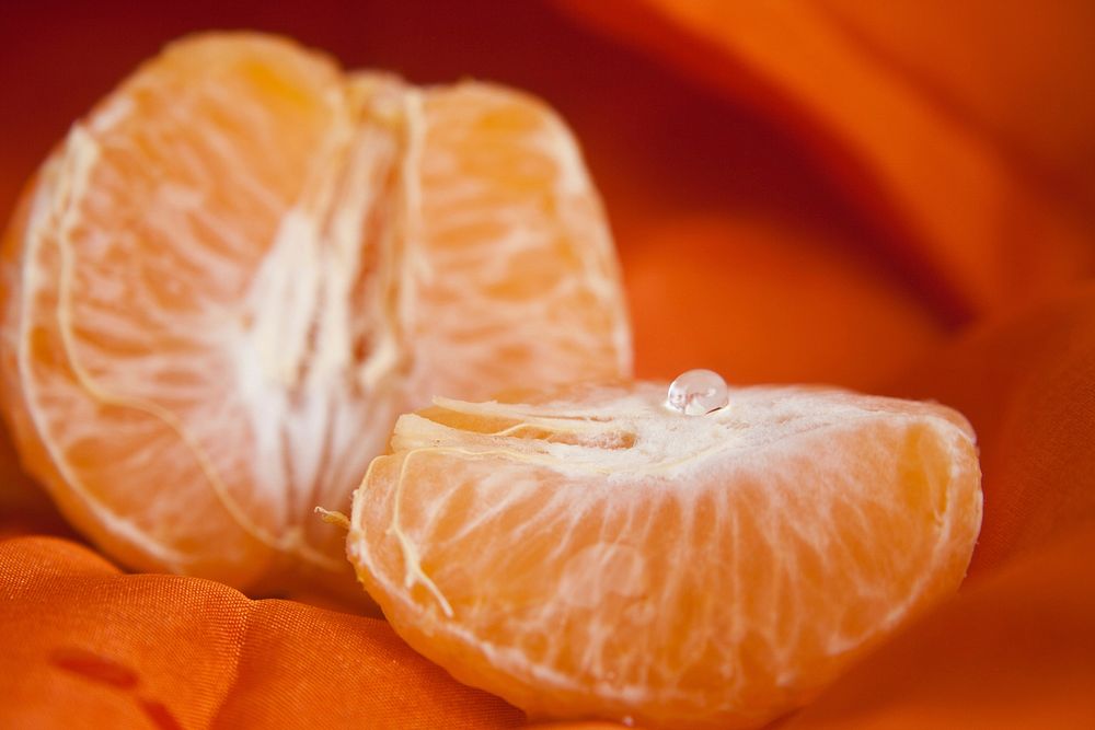Closeup on mandarin orange peeled open. Free public domain CC0 photo.