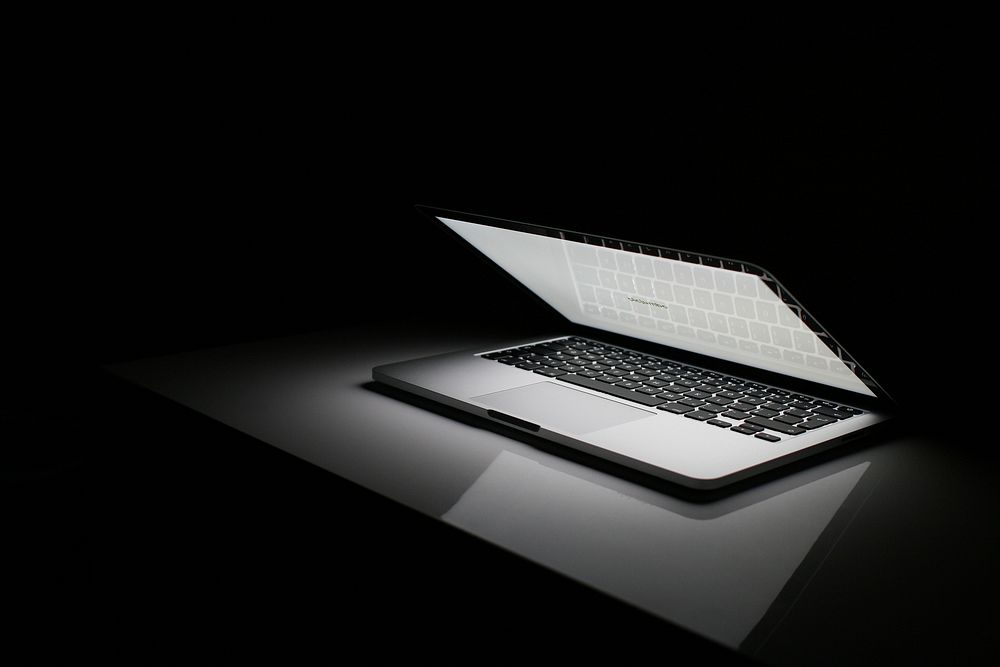 Laptop in the dark. Free public domain CC0 image.