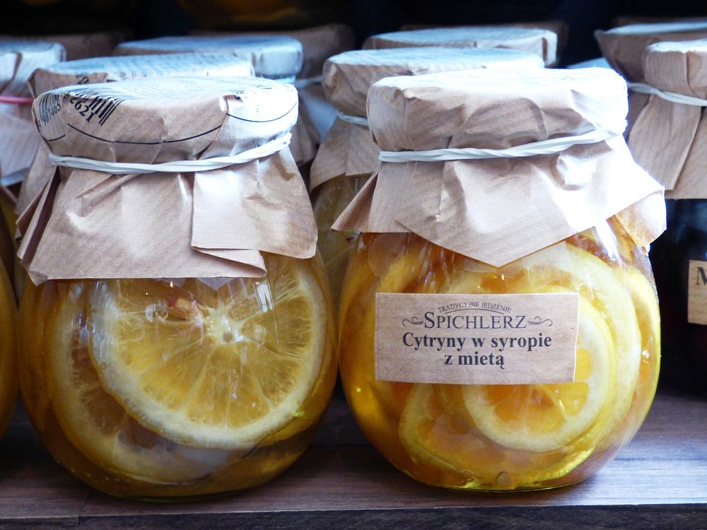 Preserved lemons in jars on rack. Free public domain CC0 image.  
