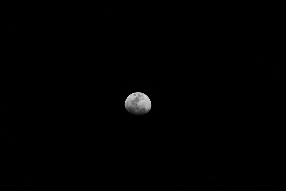 Waning moon in dark sky. Free public domain CC0 image.