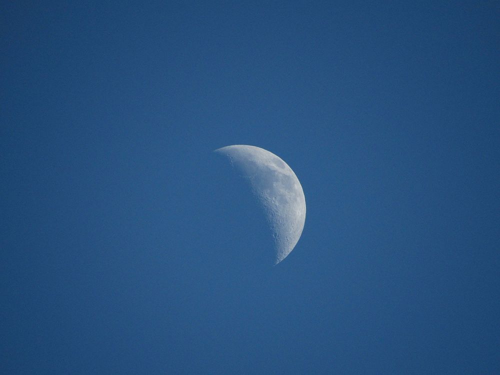 Waning moon in night sky. Free public domain CC0 photo.