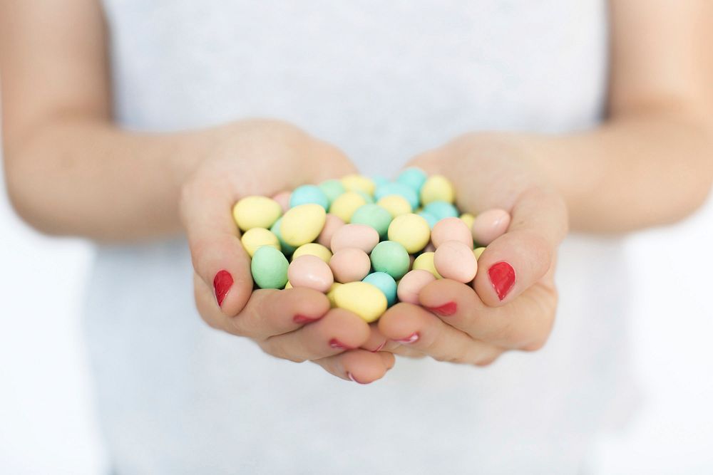 Holding Easter egg candies, free public domain CC0 photo