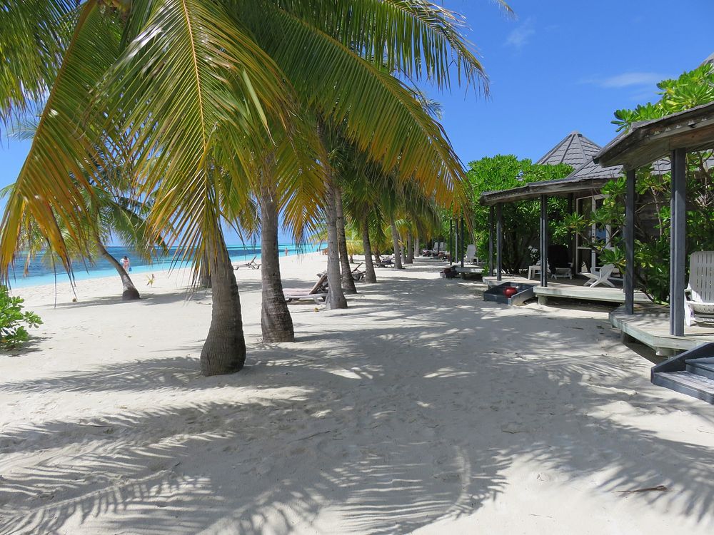 Maldives beach side hotel. Free public domain CC0 photo.